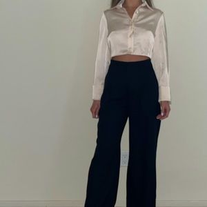 Never worn, with tags. Cropped silky button down. Ivory/cream colored.